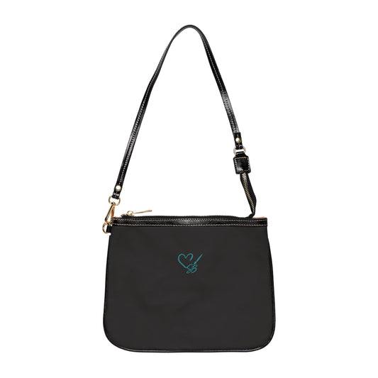 Black back of The Masquerade — A Venetian Dream small shoulder bag with the Soulful Brush heart-and-brush logo.
