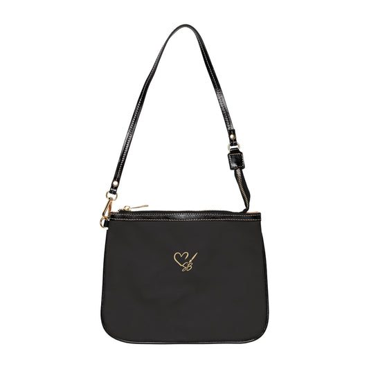 Black back of The Gilded Queen small shoulder bag with the Soulful Brush heart-and-brush logo.