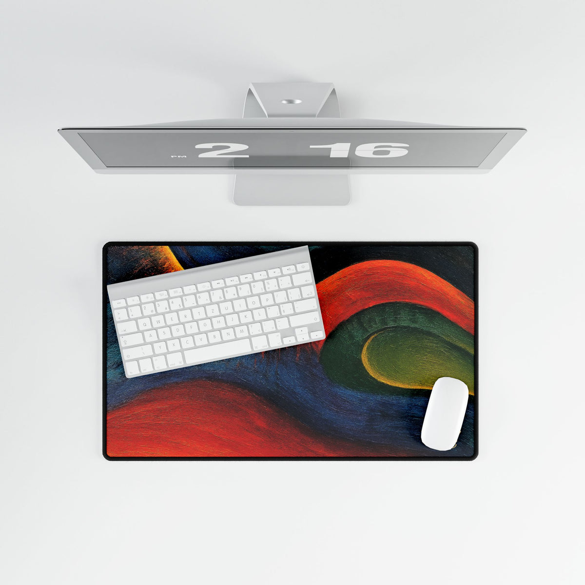 Overhead view of the rectangular abstract desk mat with keyboard and mouse.