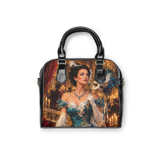Front of The Masquerade — A Venetian Dream shoulder handbag with black handles and artwork depicting a woman in a teal gown holding a feathered mask.