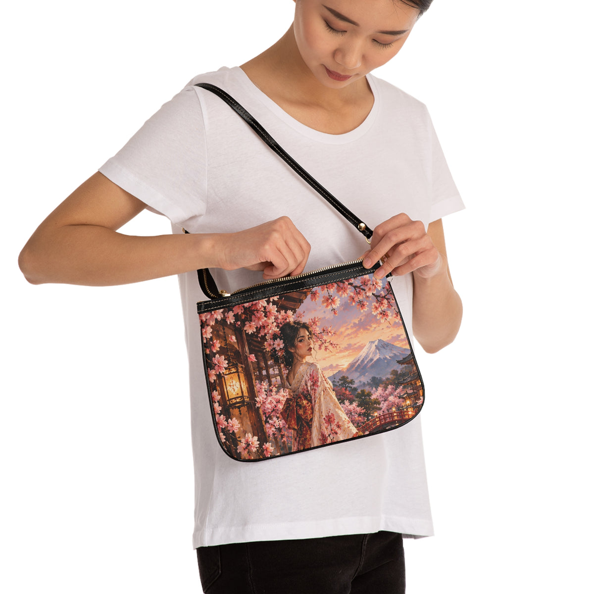 Model wearing Madama Butterfly — A Thousand Petals small shoulder bag and opening its top zipper, showing the bag's scale.