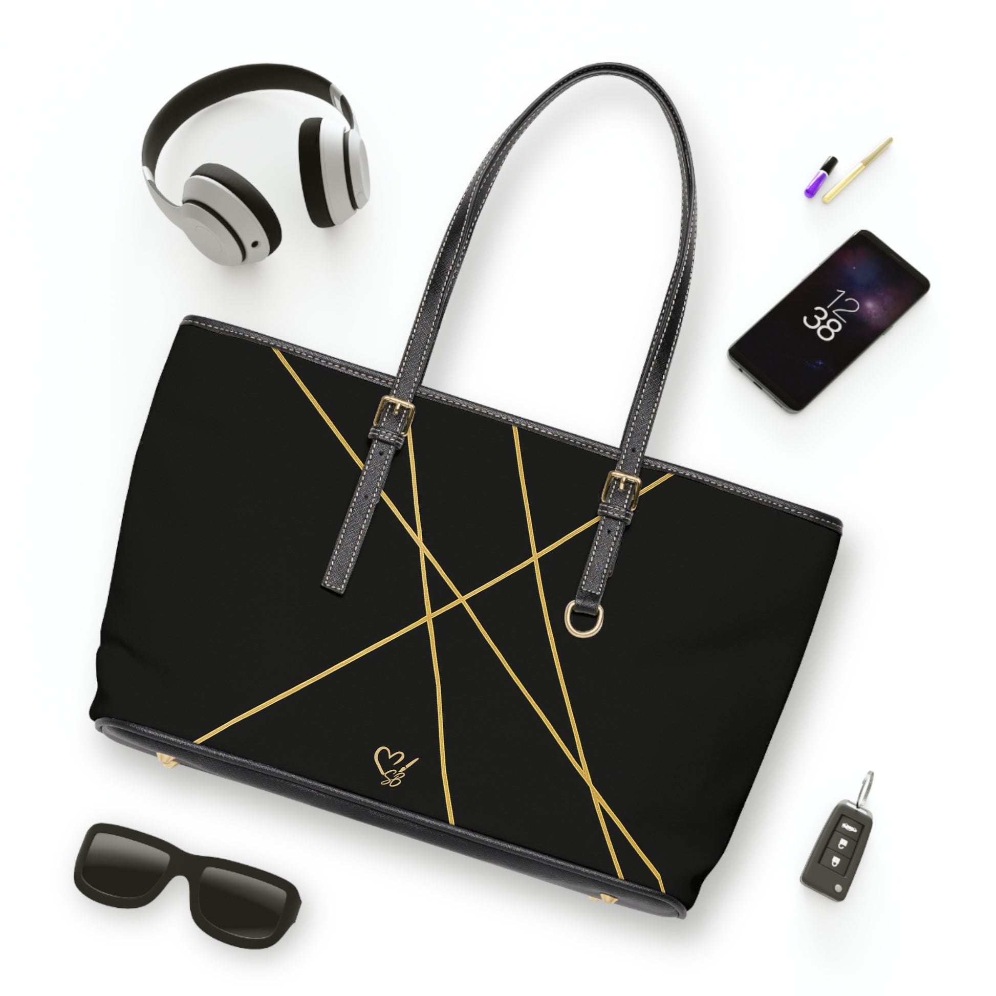 Michelle PU leather tote bag 17x11 flat lay – minimalist black gold geometric line accent handbag by the Soulful Brush
