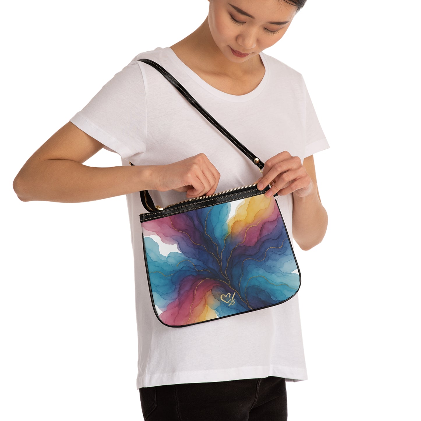 Gloria shoulder bag lifestyle shot – colorful teal indigo gold swirl small PU leather purse with adjustable strap by the Soulful Brush
