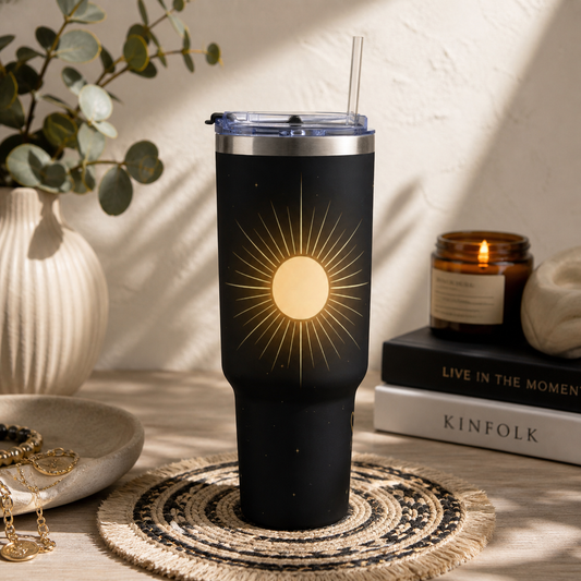 Solar Halo celestial sun 40oz tumbler lifestyle view – vacuum insulated black travel mug by the Soulful Brush
