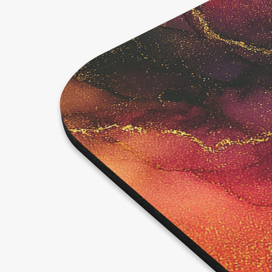 Close-up of Brittany mouse pad corner showing burgundy and orange artwork and its black edge.
