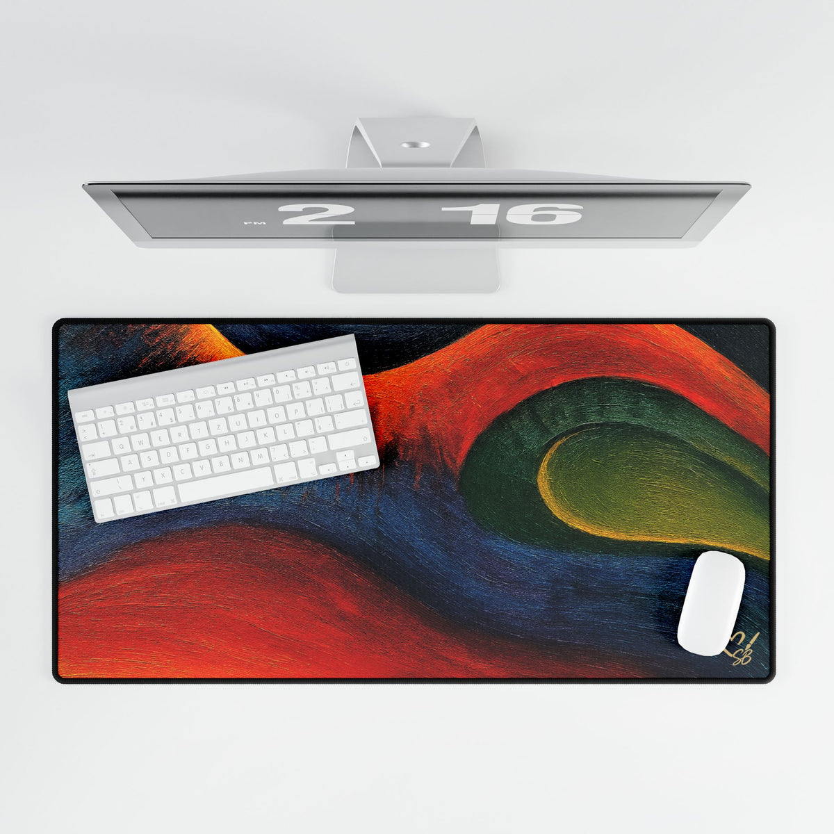 Overhead view of the wide abstract desk mat beneath a white keyboard and mouse.